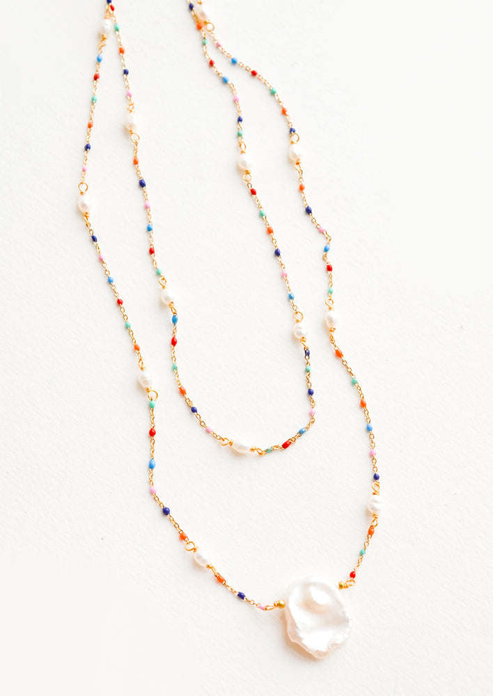 1: Delicate, layered 2-strand necklace with rainbow colored beads on fine gold chain, pearl pendant at center
