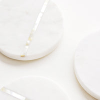 2: Detail of Round White Marble Coasters with Abalone Shell Inlay.
