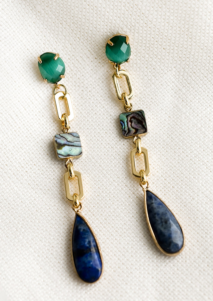 1: A pair of long drop earrings with green post and chain, abalone and lapis teardrop.