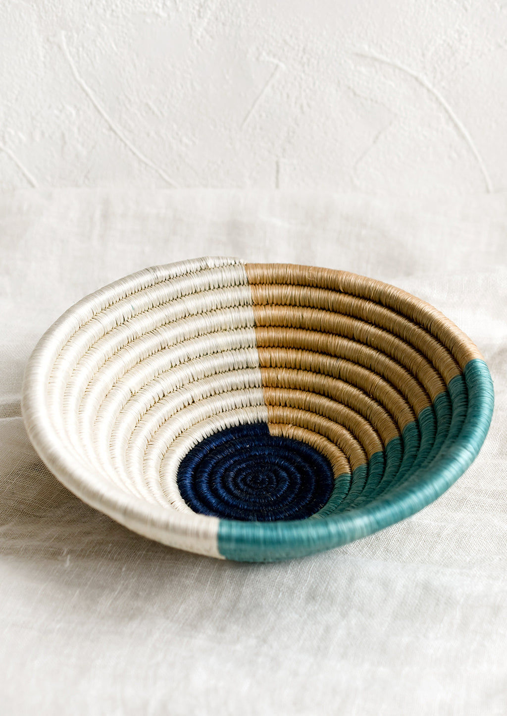 Navy Multi: A round sweetgrass bowl in navy pattern.