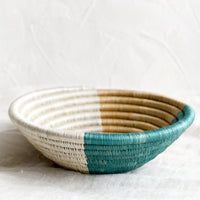 2: A round sweetgrass bowl in navy pattern.