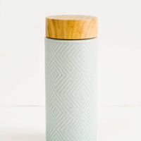 Mint Green: Geometric textured ceramic tall travel tumbler in mint color with bamboo lid