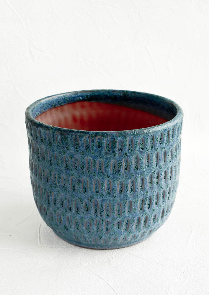 Terracotta planter in textured jewel tone blue glaze with allover line texture