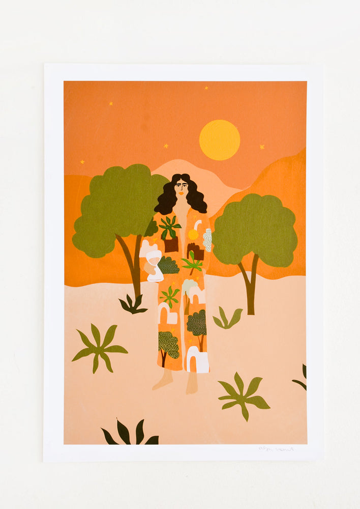 A digital art print featuring brunette woman standing in a desert wearing a printed robe.