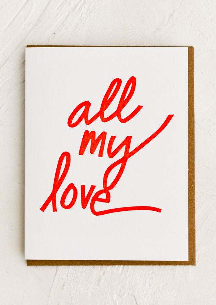 A white card with large red script reading "All my love".
