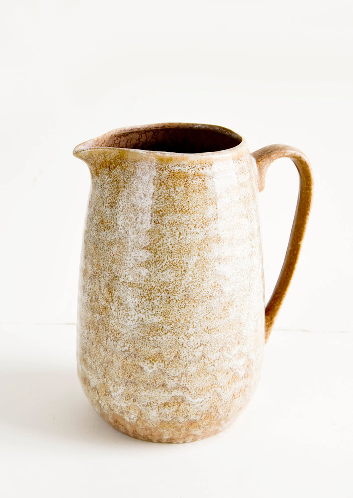 Large ceramic pitcher with handle in reactive glossy brown glaze