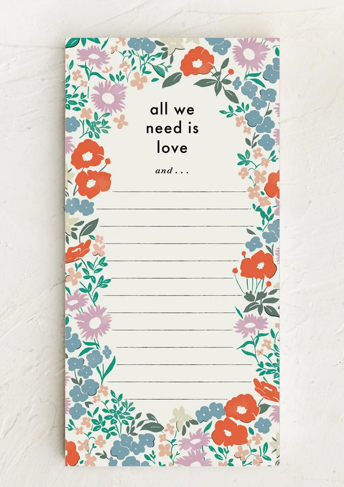 A floral print ruled notepad.