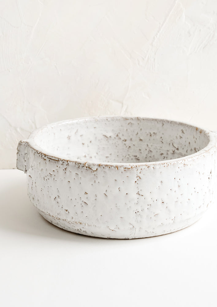 A round white serving bowl in textured glaze.