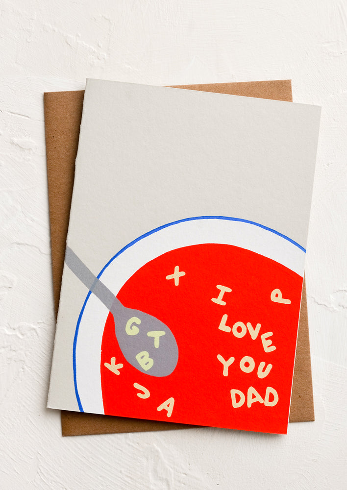 1: A greeting card with illustrated image of bowl of alphabet soup spelling "I love you dad".