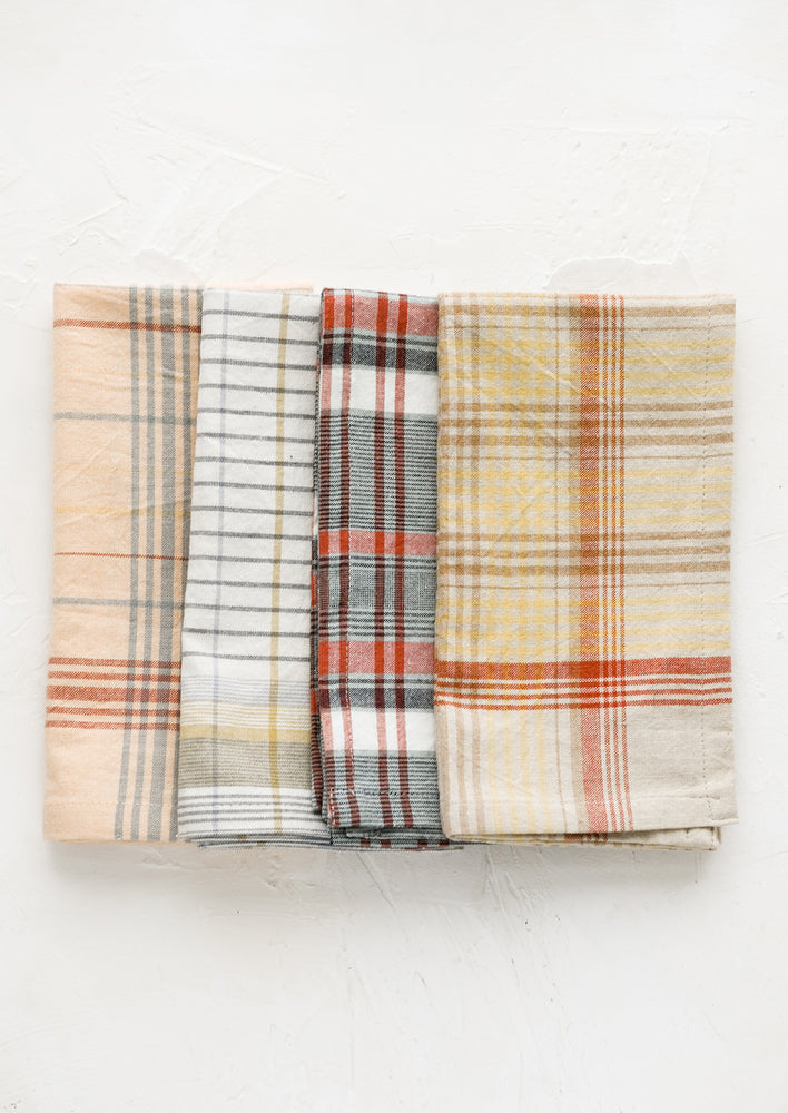 2: A set of four napkins in plaid pattern and assorted colors.