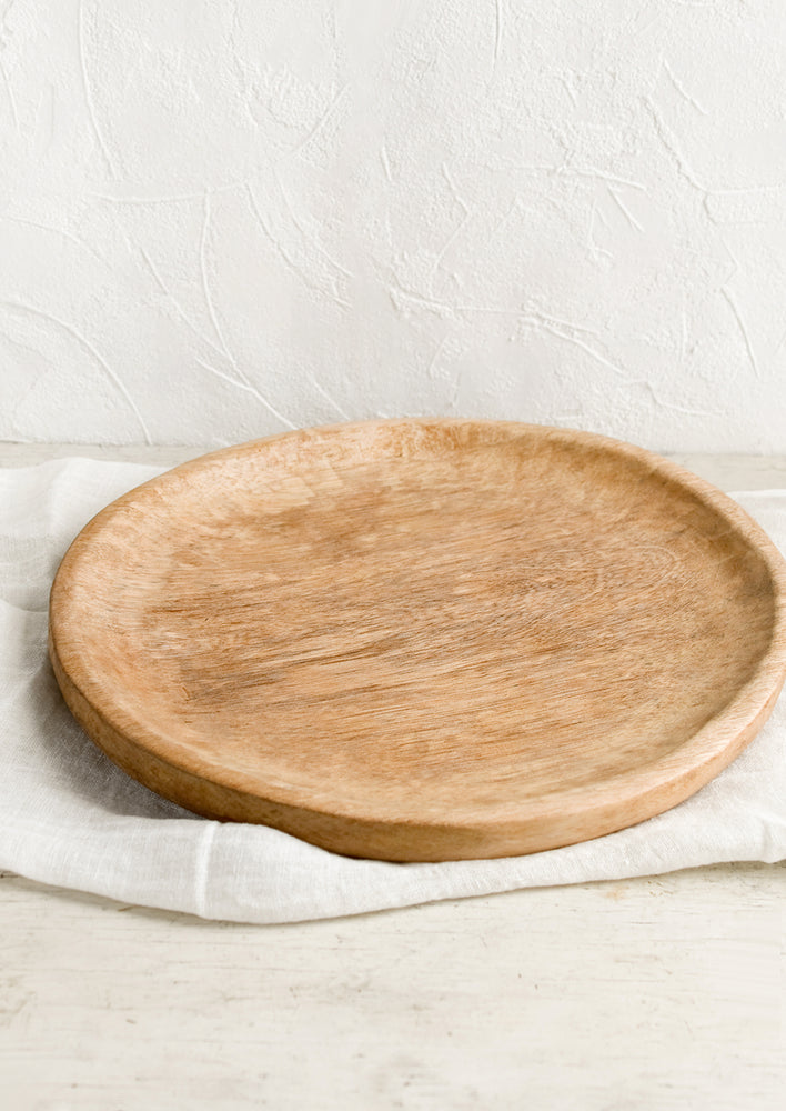 A round hardwood platter.