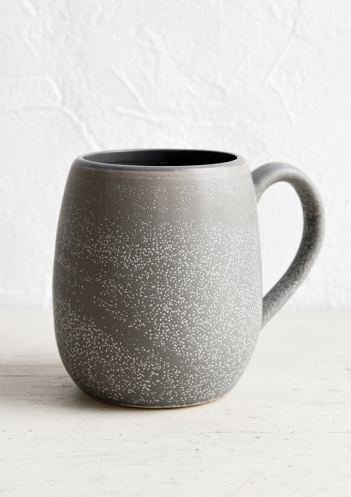 1: A large ceramic mug in dark grey with light speckles.