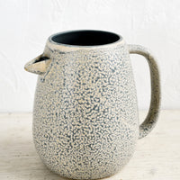 1: A ceramic pitcher with built-in spout in speckled grey and natural glaze.