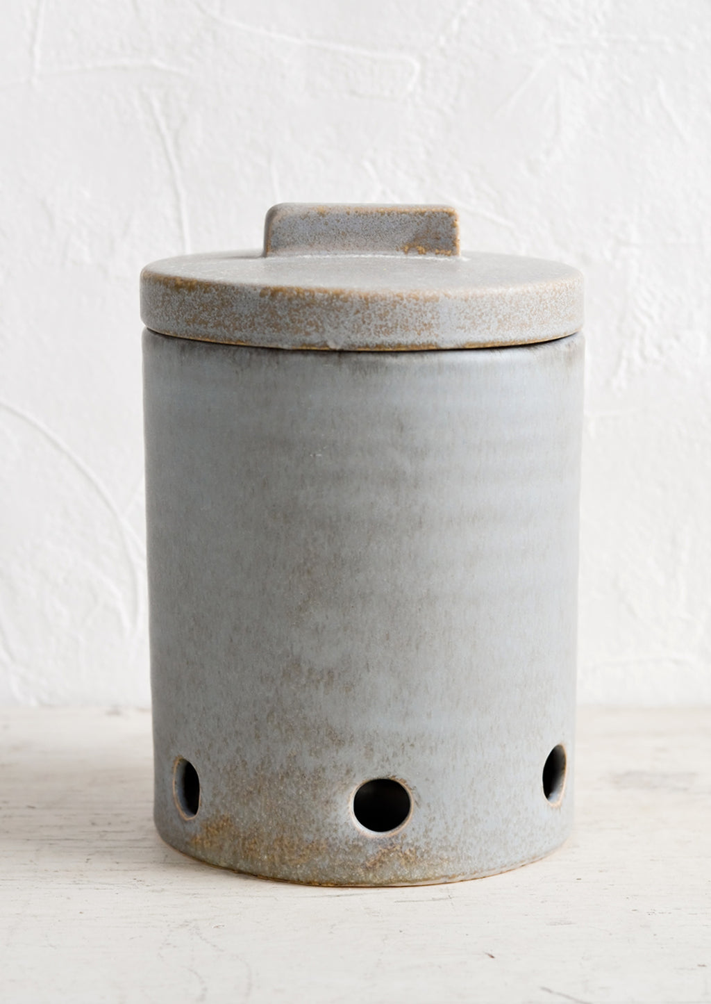 2: A large ceramic kitchen storage jar intended for onion storage.