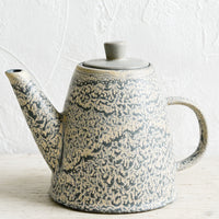 1: A ceramic lidded teapot in grey and natural speckled glaze.