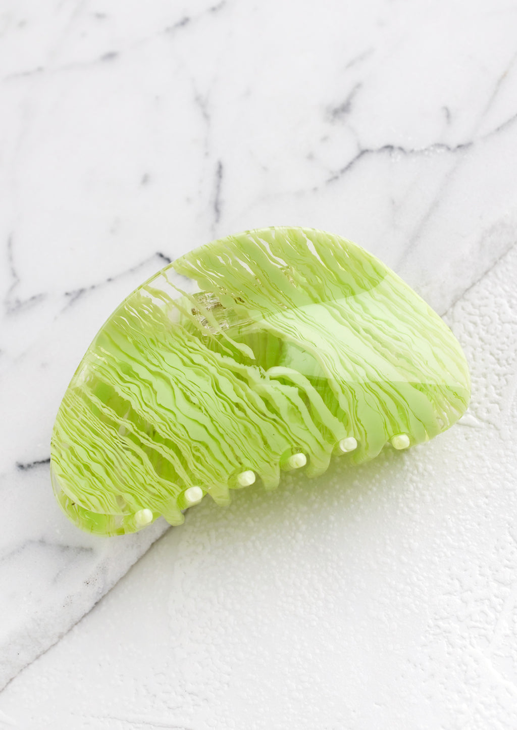 Lime: An asymmetric hair claw in lime streak print.