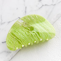 Lime: An asymmetric hair claw in lime streak print.