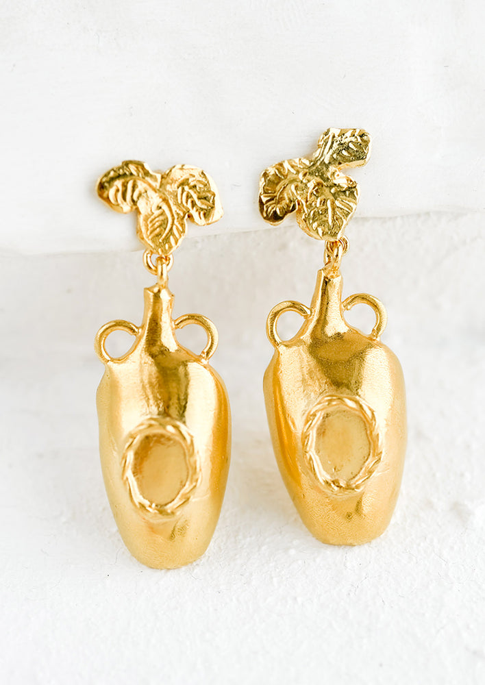 A pair of jug shaped earrings with grapevine shaped post.