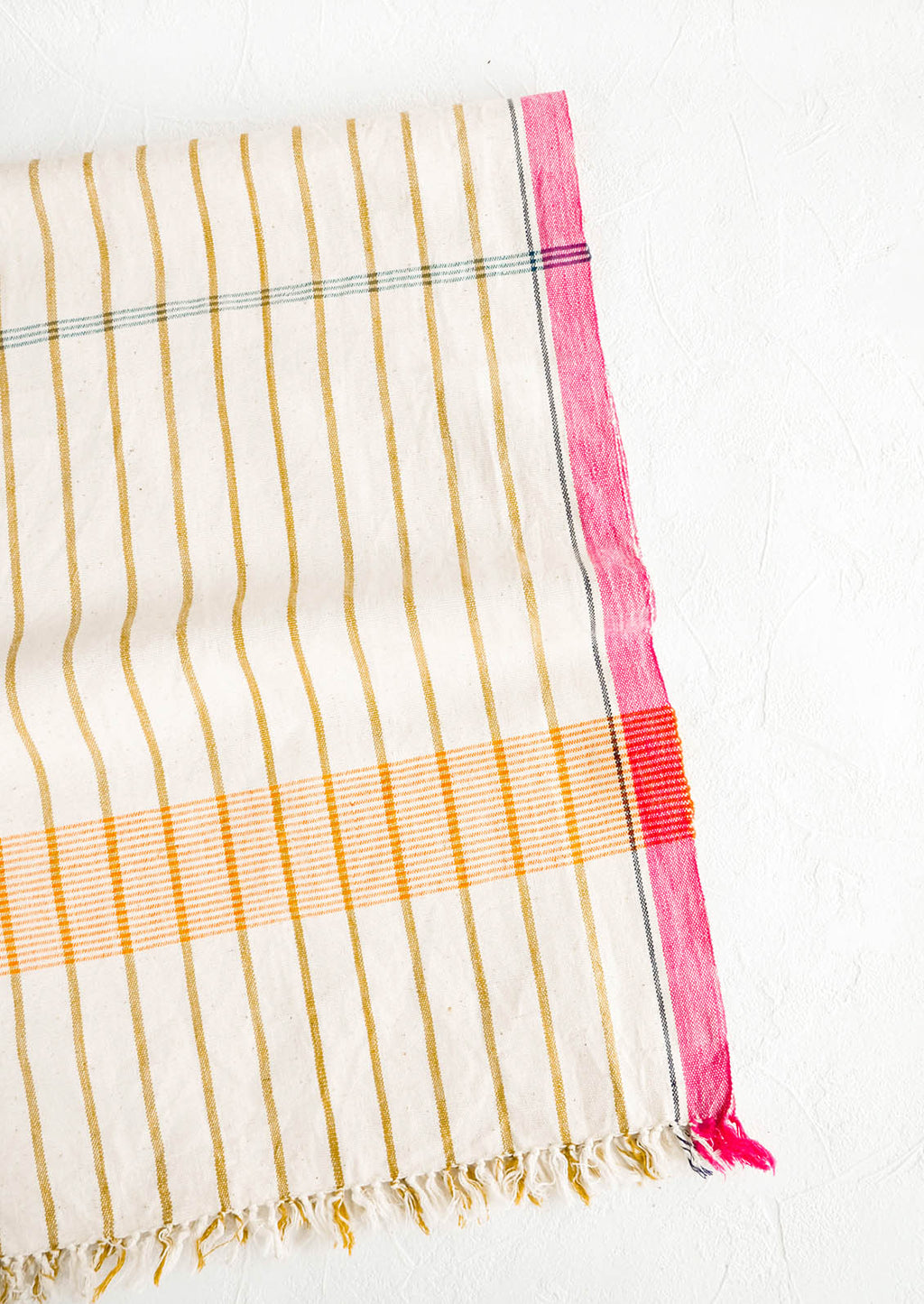 3: Cotton table runner in plaid/stripe print in a mix of bright colors