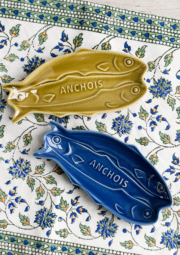 1: Green and blue ceramic dishes in shape of sardines.