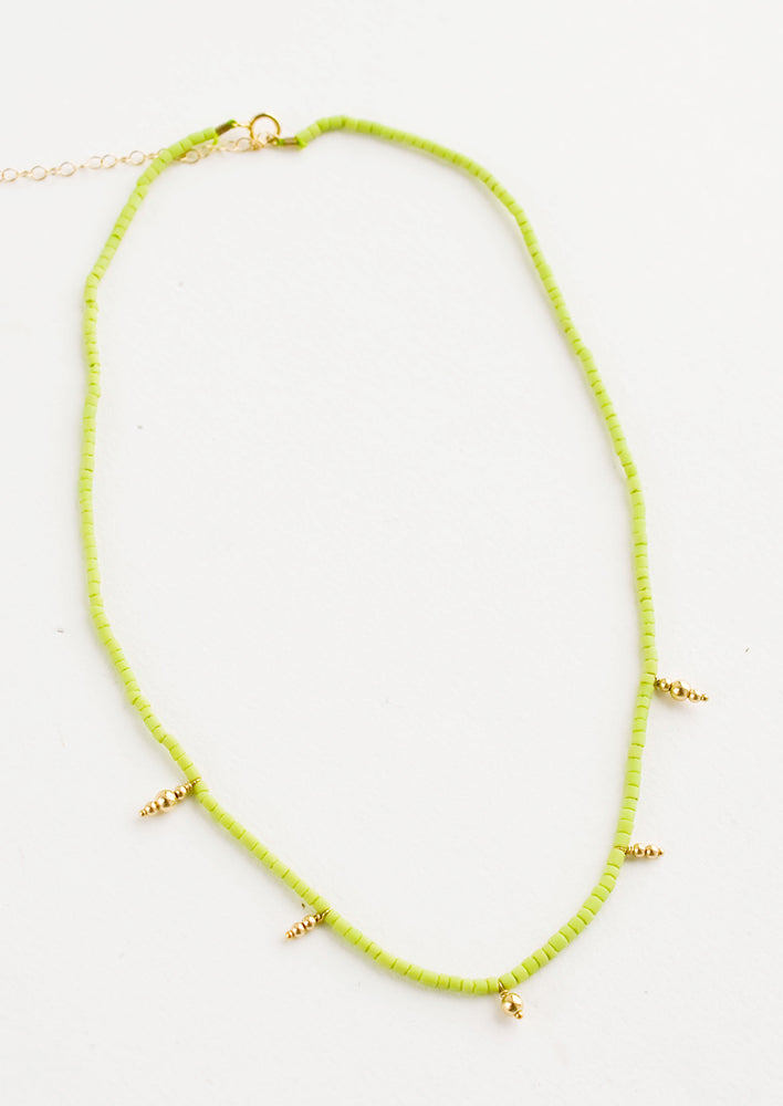 Beaded necklace with small lime green and gold beads