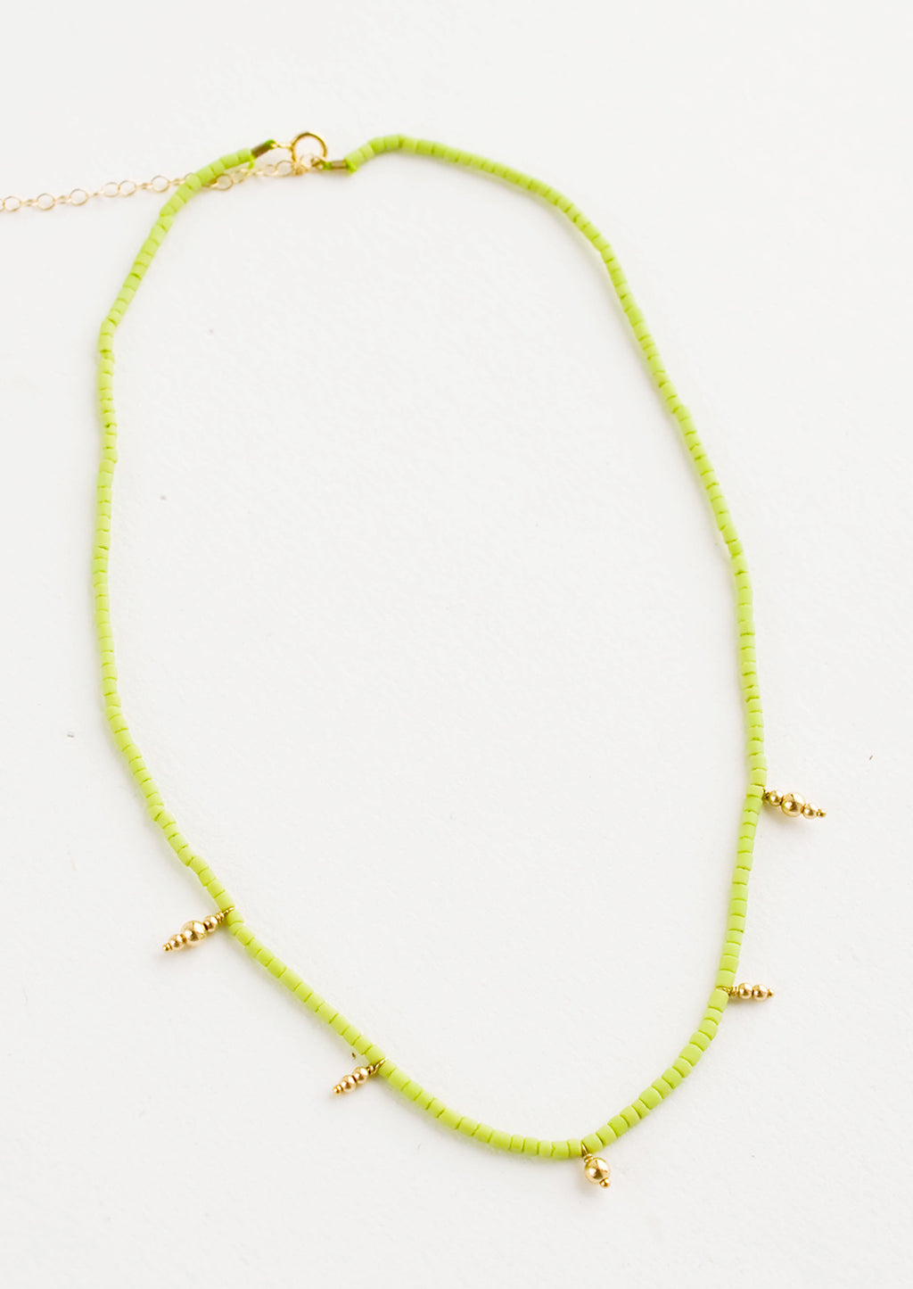 Lime: Beaded necklace with small lime green and gold beads