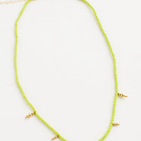 Lime: Beaded necklace with small lime green and gold beads