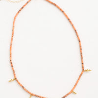 Peach: Beaded necklace with small peach and gold beads