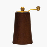 Dark: A wood and brass grinder in dark wood.