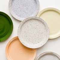 2: Assorted ceramic side plates in a mix of colors and glaze finishes.