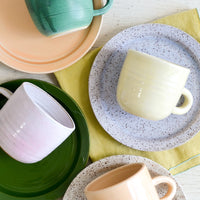 5: A mix of hand glazed plates and mugs.