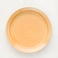 Nectar (Satin): A ceramic side plate in glossy peach glaze.