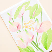 2: Greeting card with painted florals and "Happy Mothers Day" written in gold.