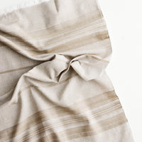 Toasted Wheat: A crumpled brown cotton towel with textured stripe and fringe edge.