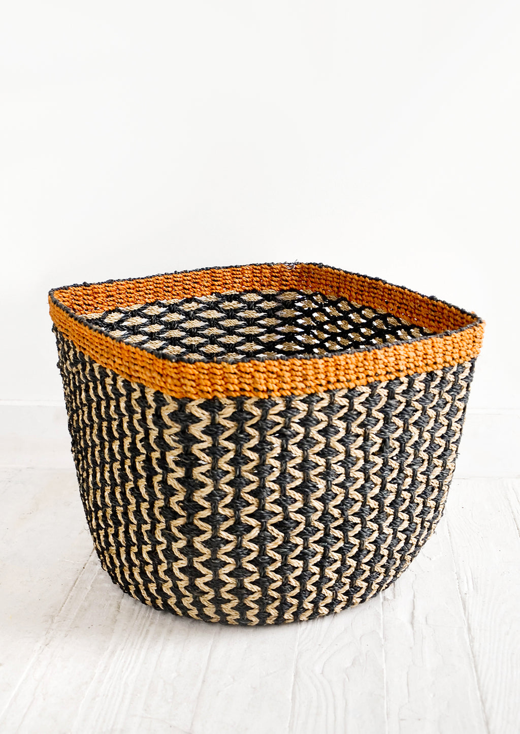 Medium: Square storage basket in black with tan zigzag design and orange top rim
