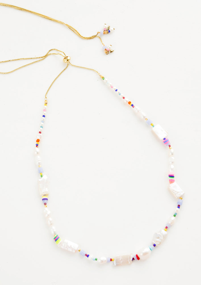 3: Beaded necklace with a mix of beads with long adjustable gold box chain