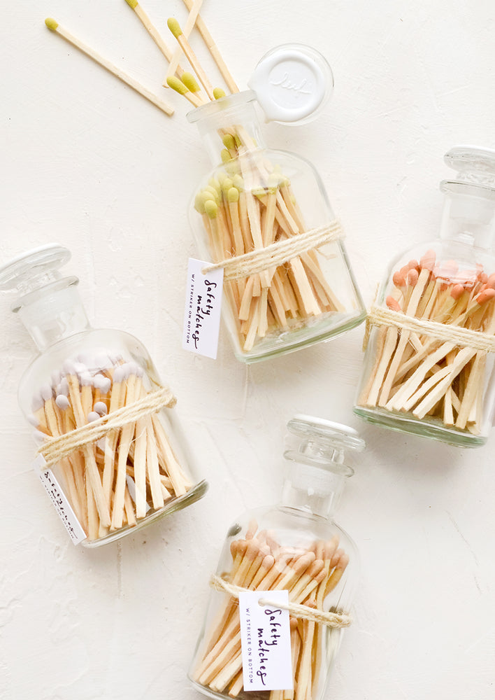 1: Safety matches in vintage style glass apothecary jars, with four match tip color options.