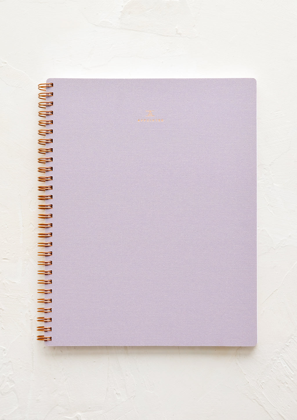 Lavender: A spiral bound notebook in purple.