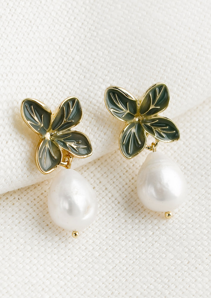 Four Leaf: A pair of earrings with four leaf enamel post and pearl.