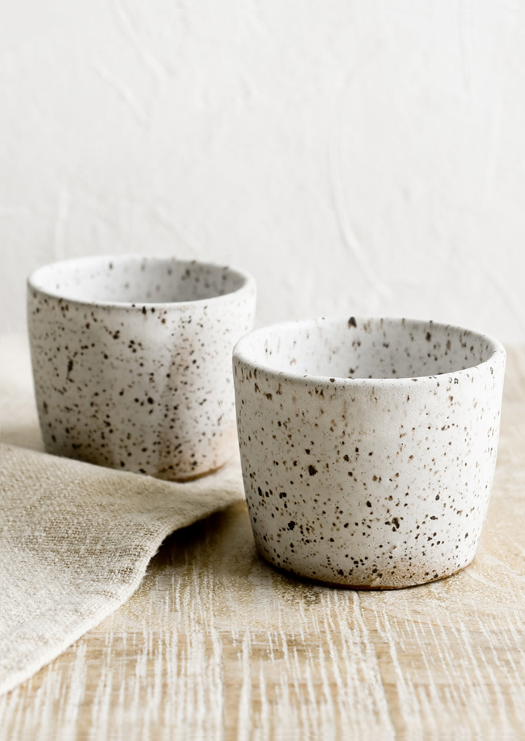 Speckled White: Two espresso cups in speckled white ceramic.