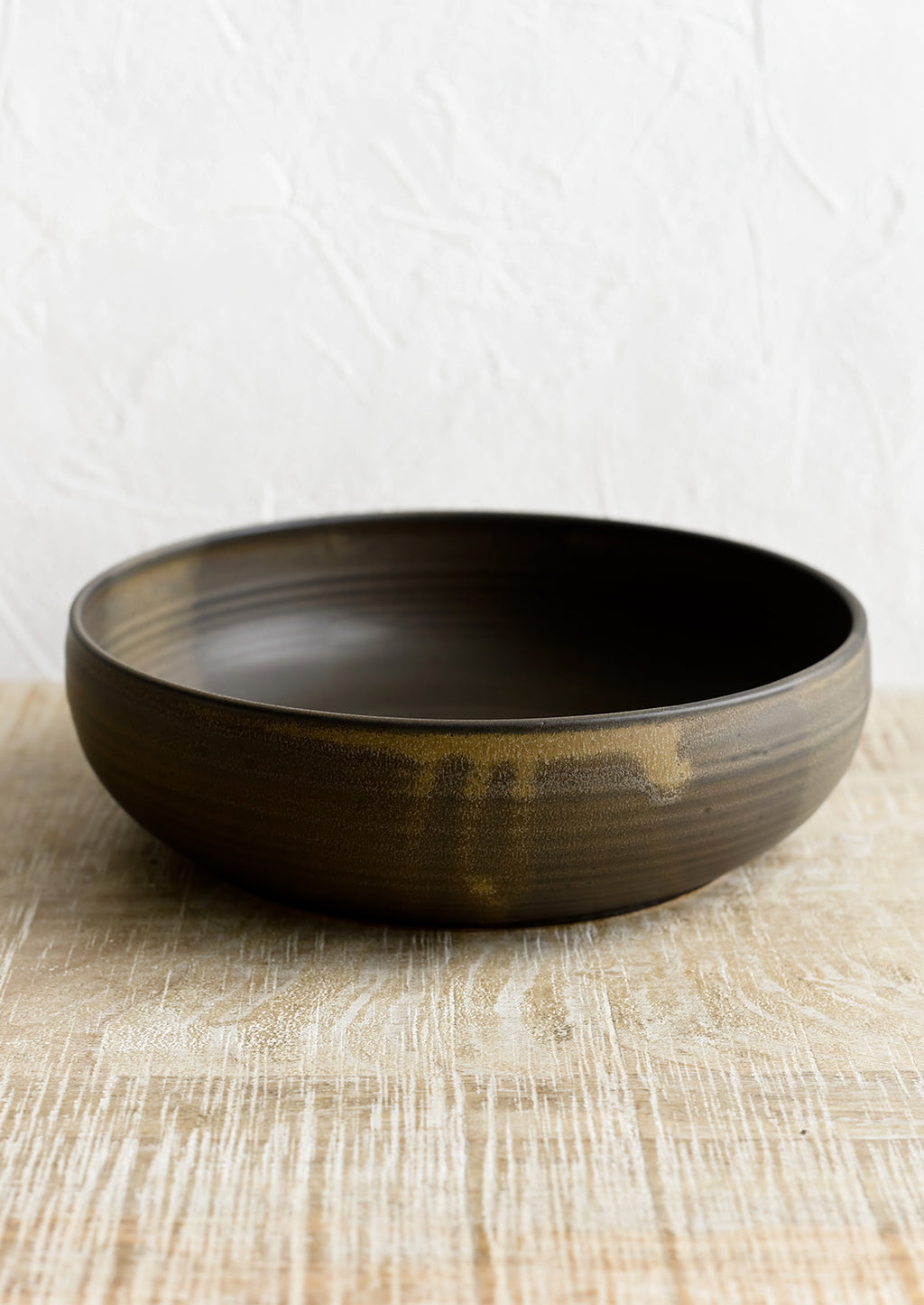 Matte Earth: A ceramic serving bowl in matte brown.
