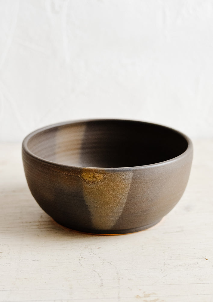 A ceramic soup bowl in matte brown.