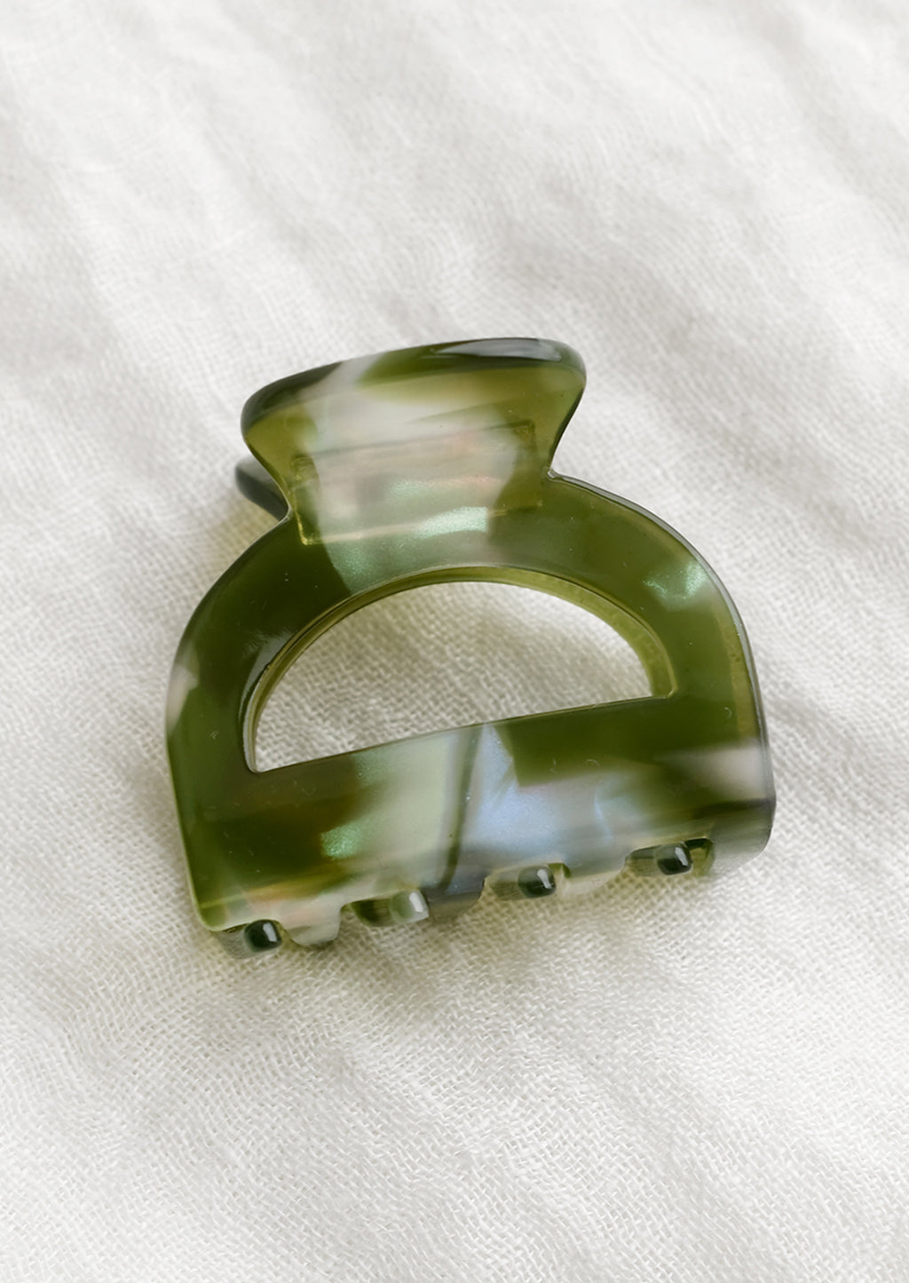 Olive Pearl Multi: An arch shaped hair claw in olive pearl.