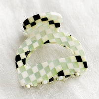 Discoteque Checker: An arch shaped hair claw in checker.