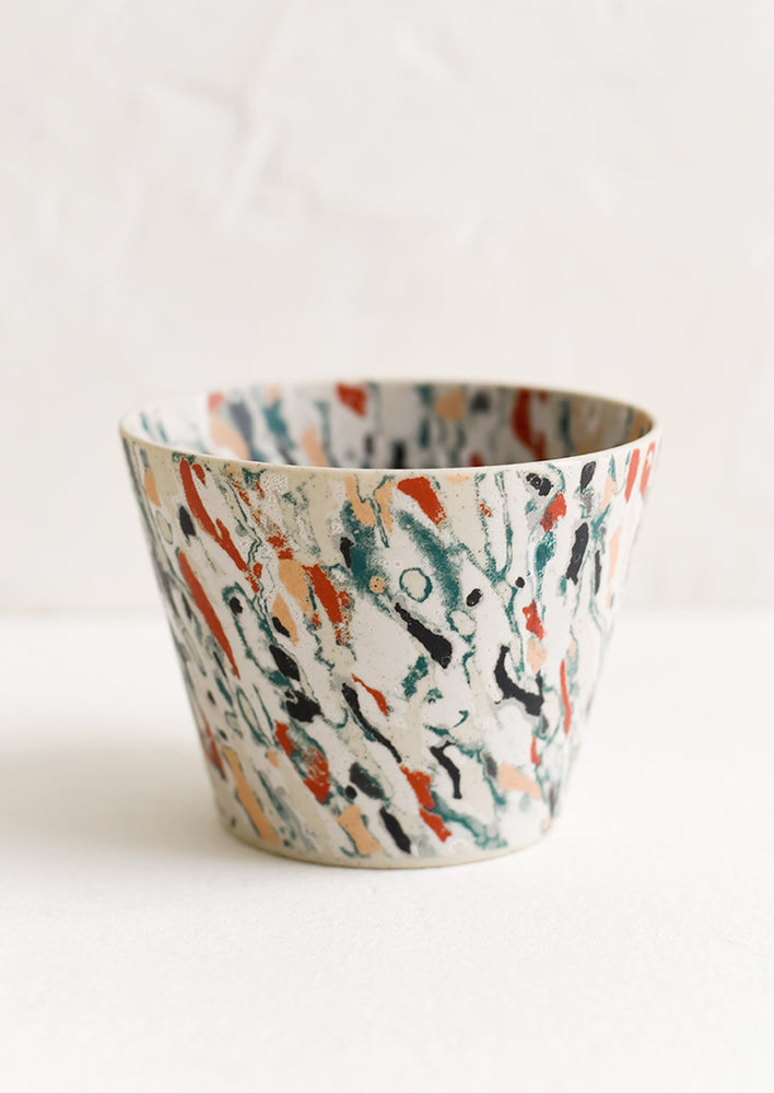 1: A marbleized porcelain cup.