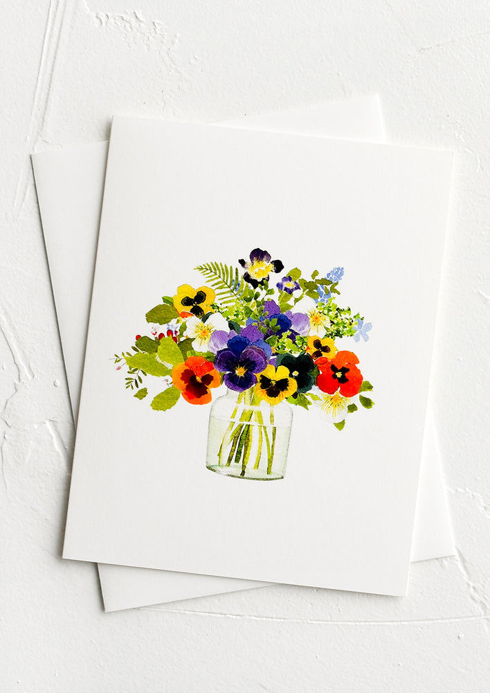 A greeting card with illustration of annual flowers in a vase.