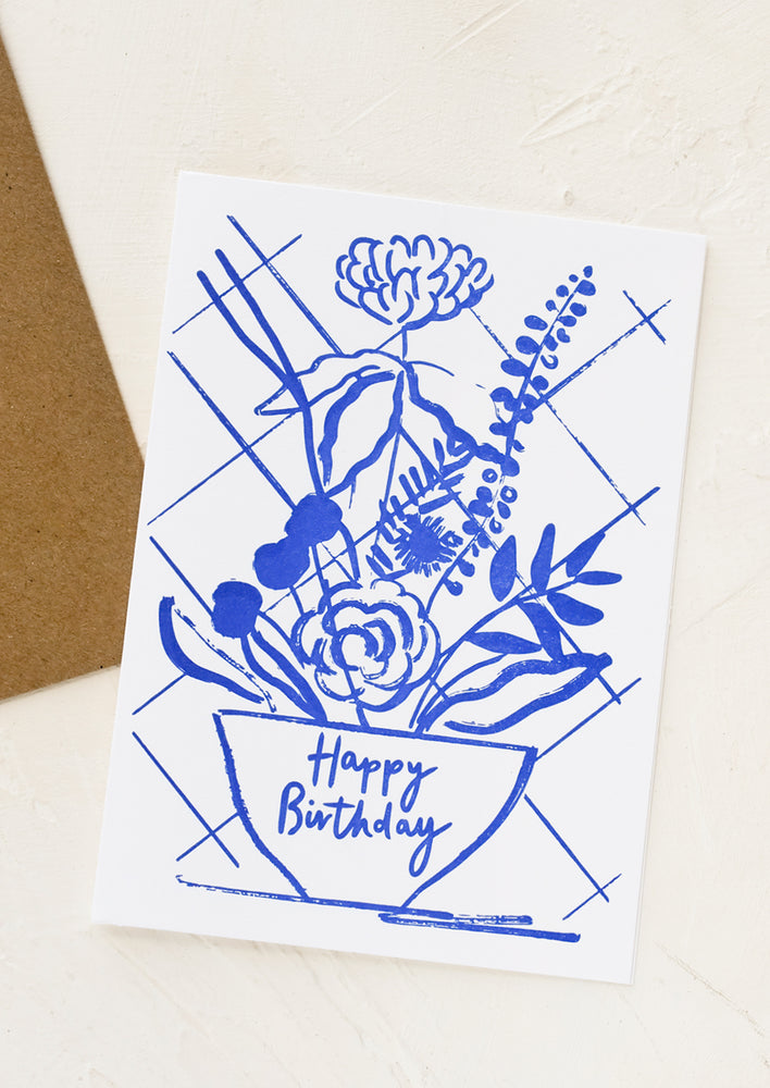 A birthday card with blue floral design.