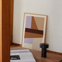 2: A framed photographic art print leaning against a wall.