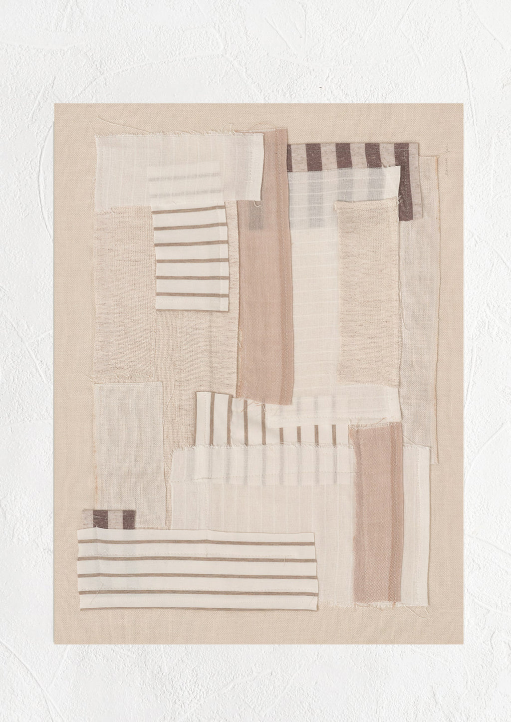 1: A photographic art print of layered beige fabric.