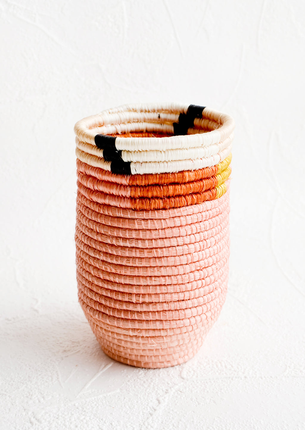 1: Pencil cup shaped woven sweetgrass basket in pink color combo with geometric trim
